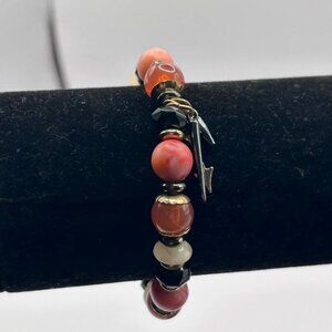 Peach and gold accent elastic bracelet with arrow charms